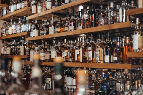 picture of the back of a bar full of alcohol bottles