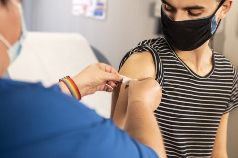 photo of a girl receiving a vaccination